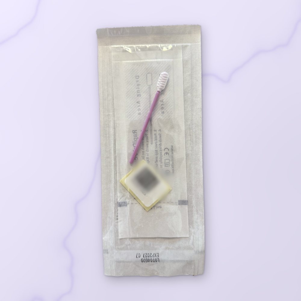 A sealed cheek swab in its sterile packet